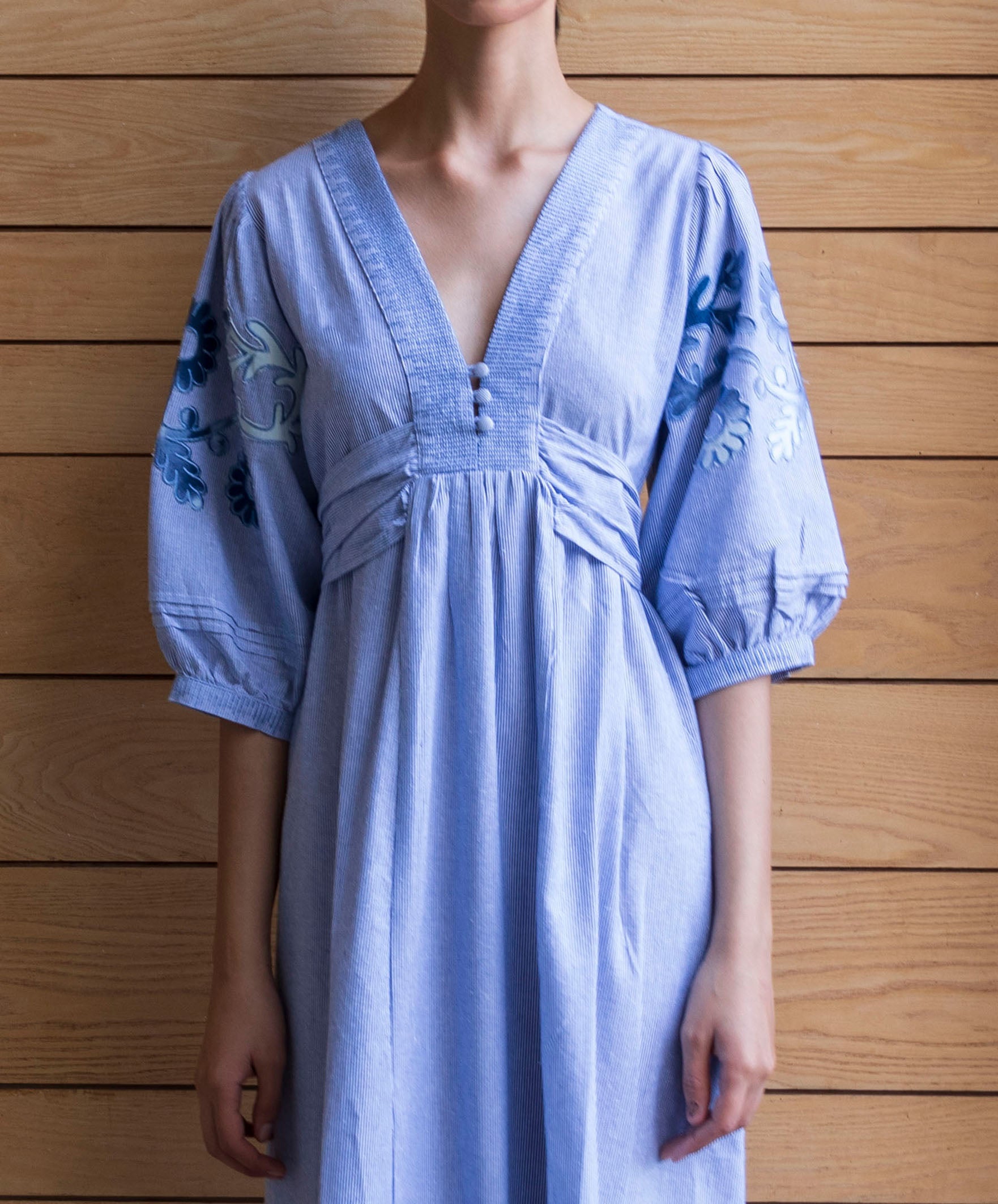Details from the blue striped Begonia dress with denim applique decoration.