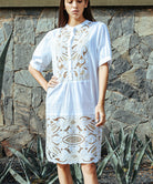 Close up details of the Rose and Rose Bond embroidered dress in white cotton.