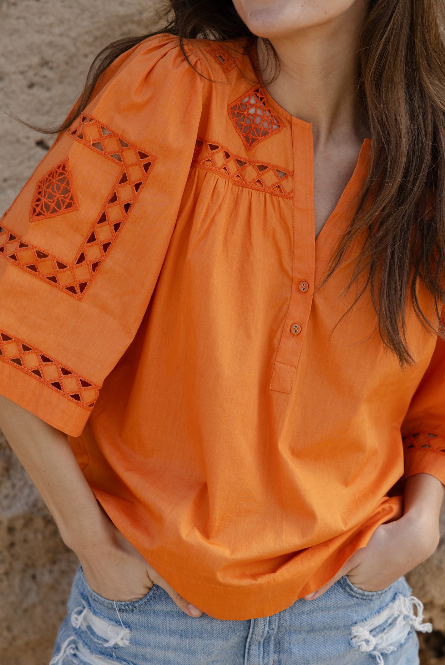 Close up embroidery and cut out details of the Rose and Rose Bordeaux cotton top.