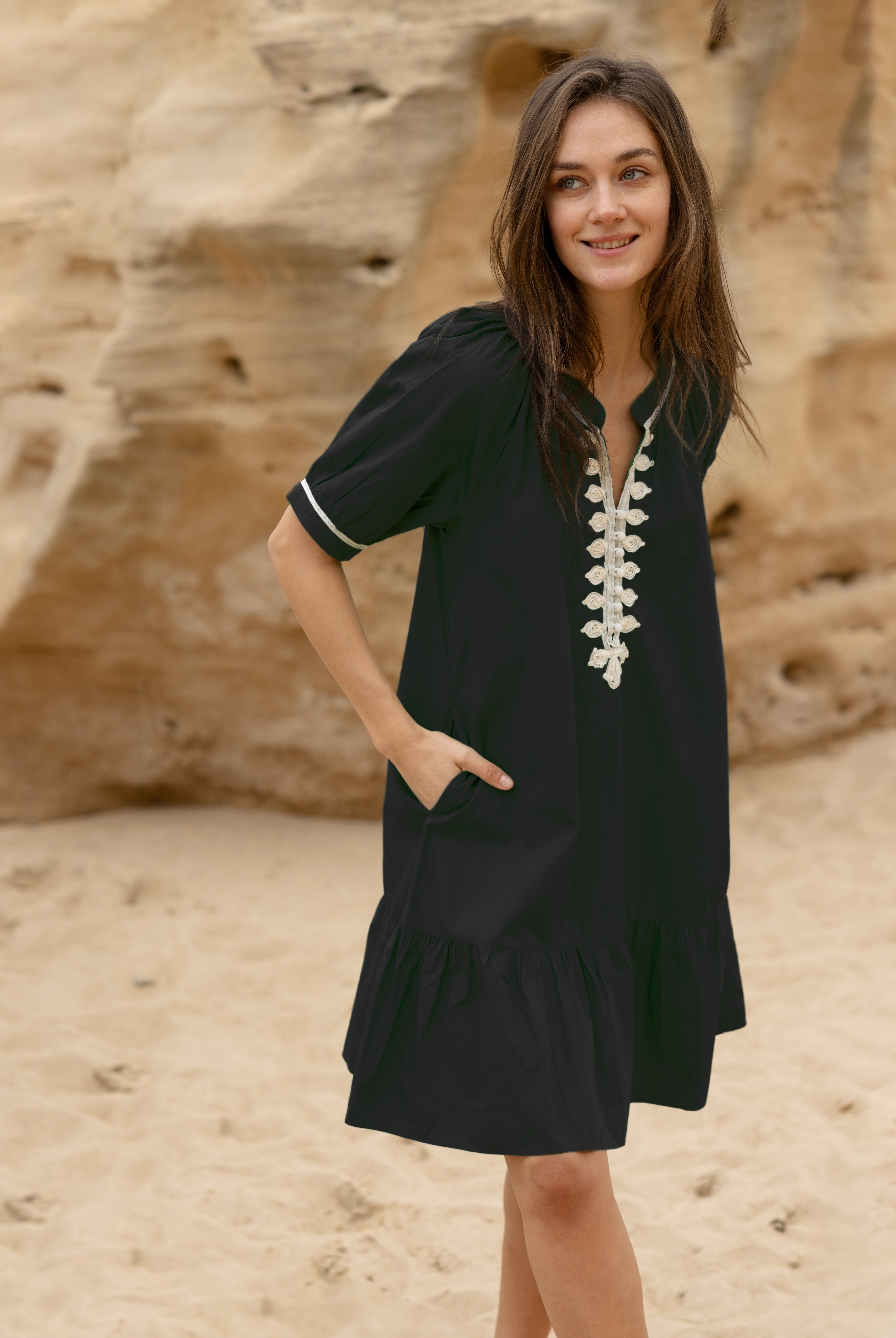 A model wears a Rose and Rose Cannes dress in black