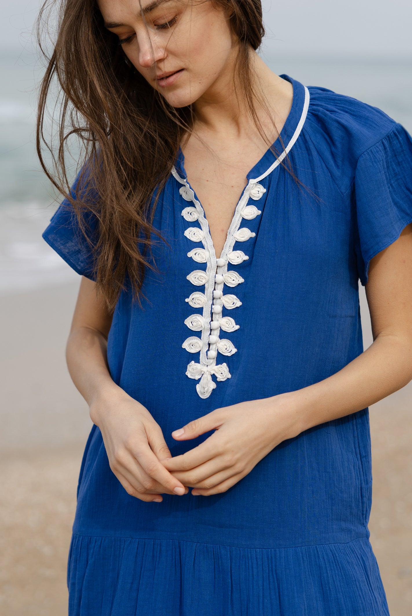 Details of the passementerie decoration on the Rose and Rose Deauville blue maxi dress.