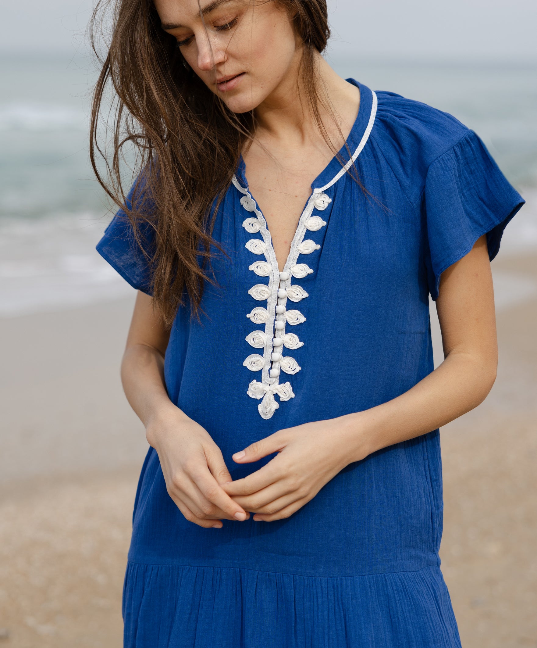 Details of the passementerie decoration on the Rose and Rose Deauville blue maxi dress.