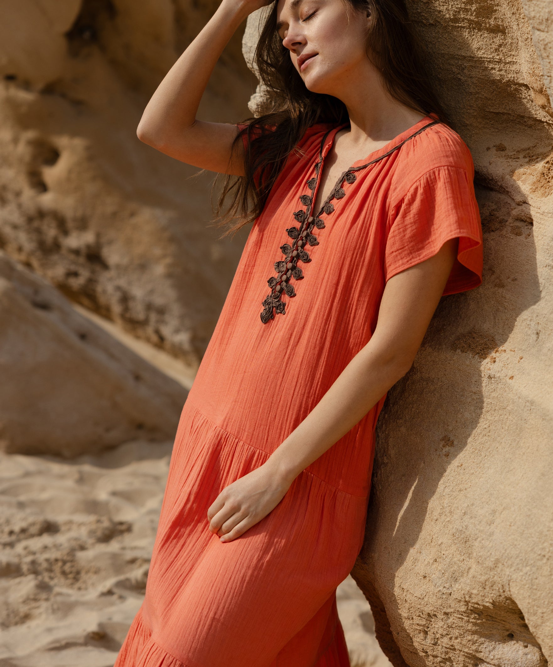 Details of the passementerie decoration on the Rose and Rose Deauville coral maxi dress.