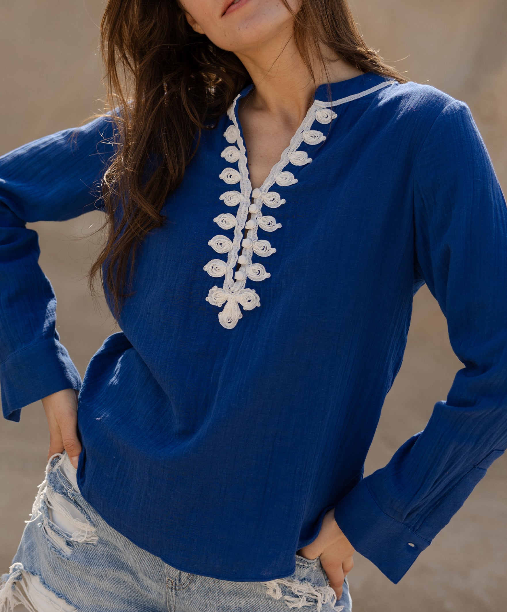 Details of the passementerie decoration on the Rose and Rose blue Dinard shirt.