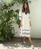 A model wearing a Rose and Rose Fulham dress.