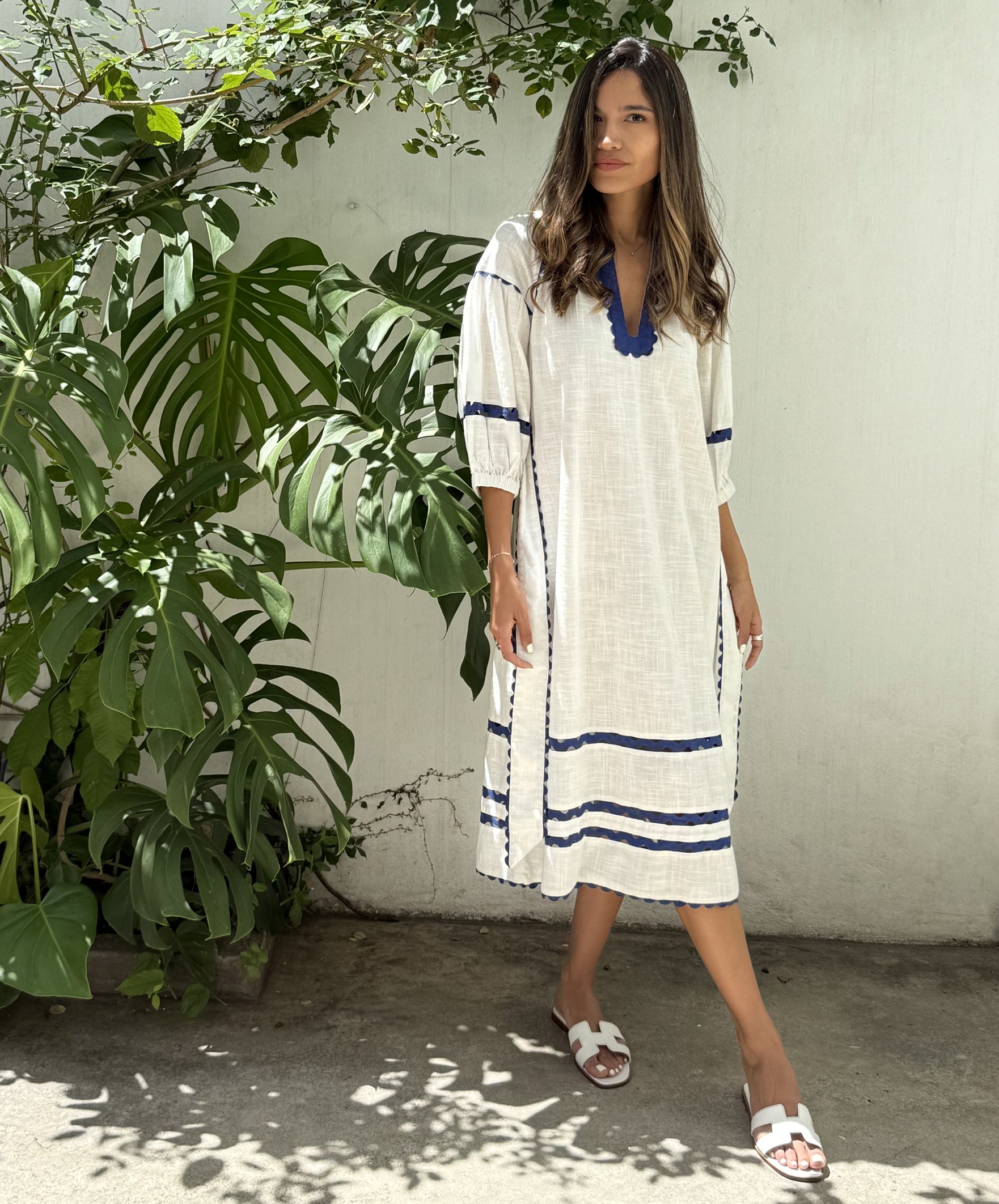 A model wearing a Rose and Rose Fulham dress.