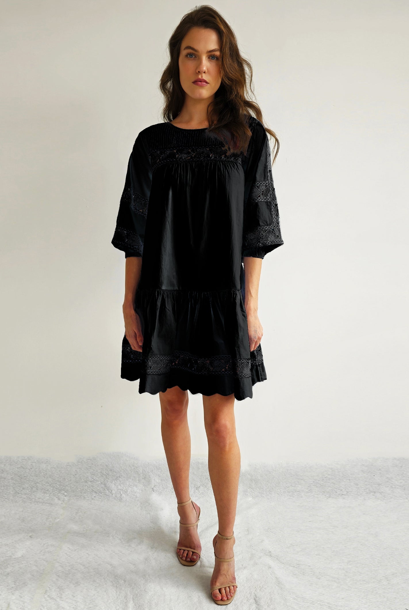 A model wears a Rose and Rose La Rochelle dress in black.