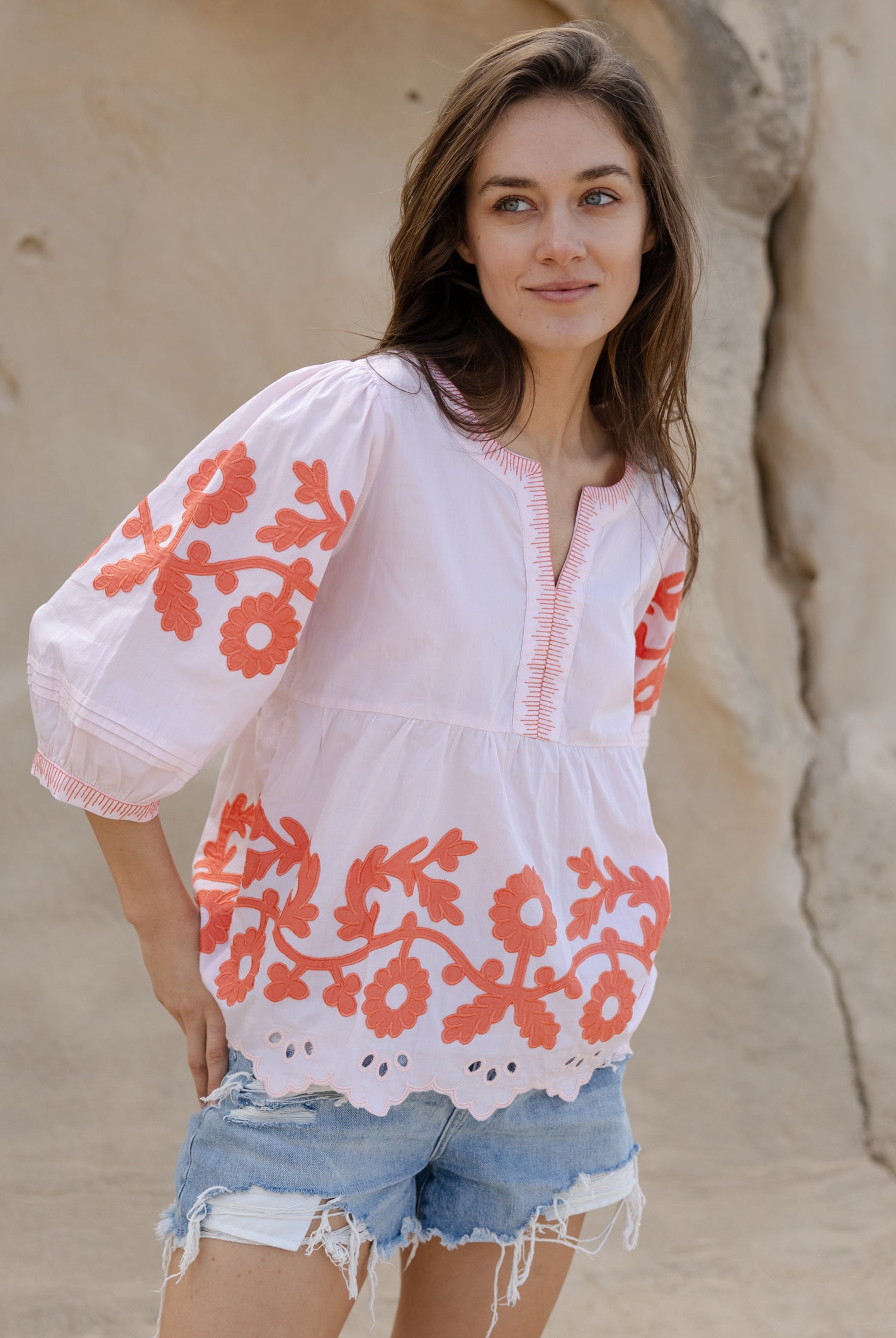 A model wearing a Rose and Rose Nantes top in shell pink cotton.