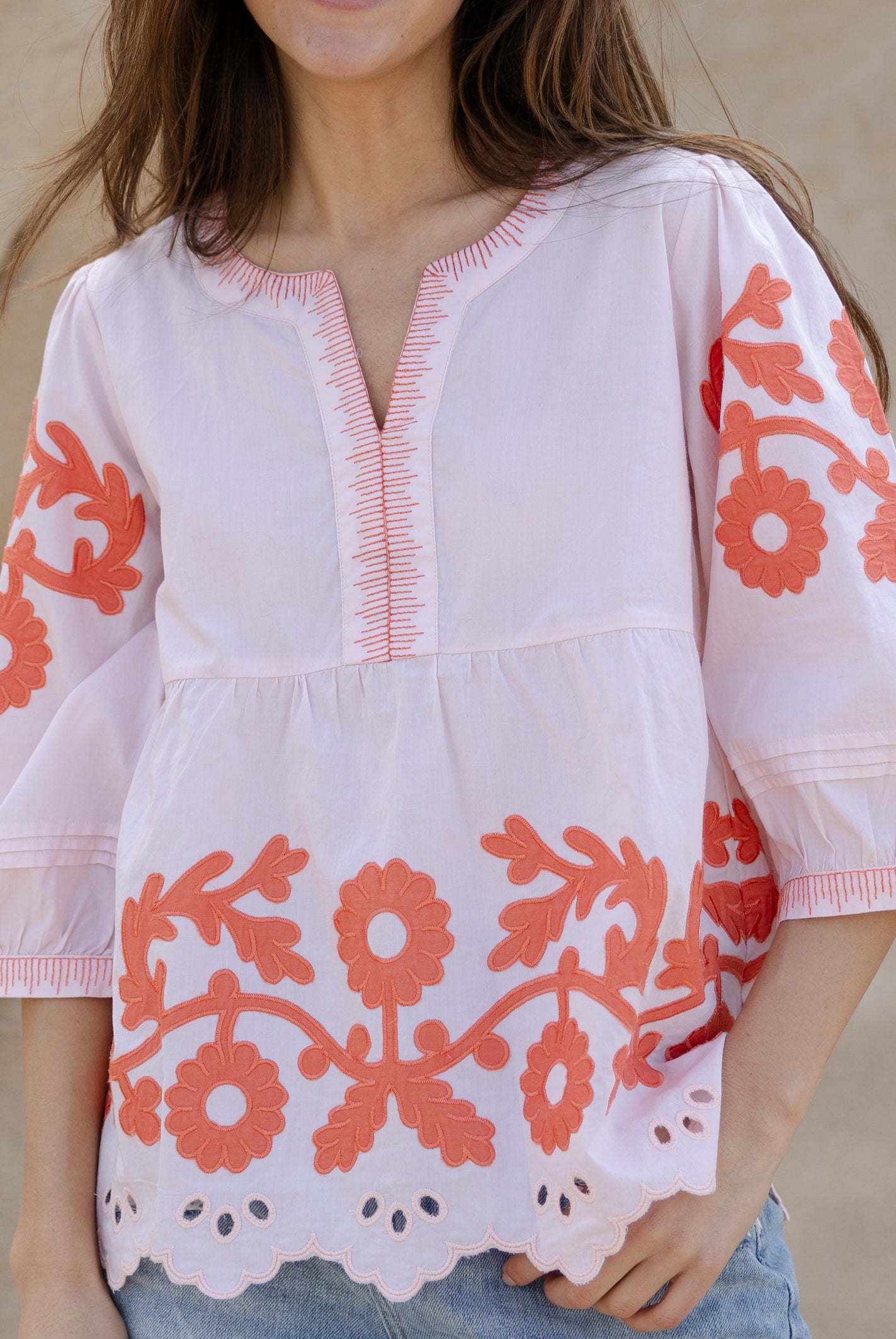 Details of the applique embroidery and pleats on the Rose and Rose Nantes pink cotton top.