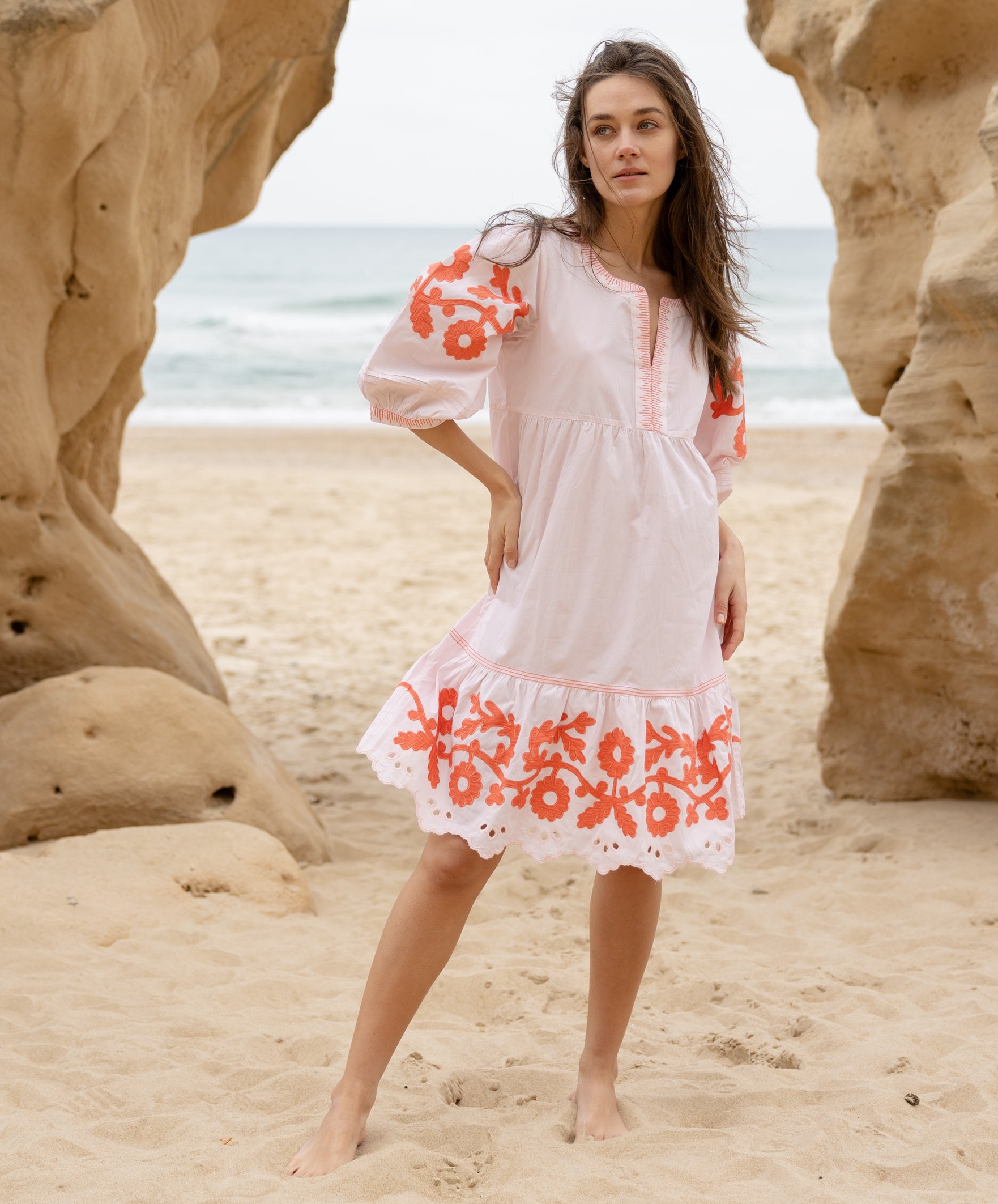 A model wearing a Rose and Rose Nice dress in shell pink cotton.