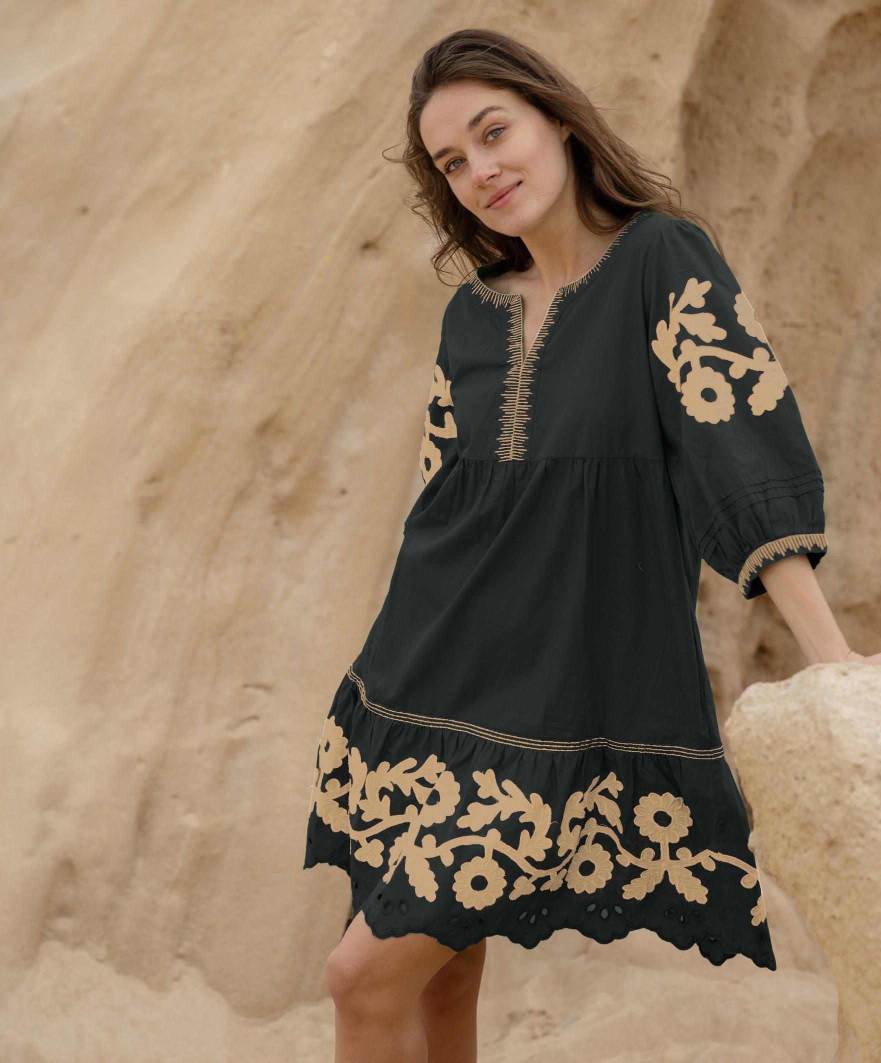 A model wearing a Rose and Rose Nice dress in black.