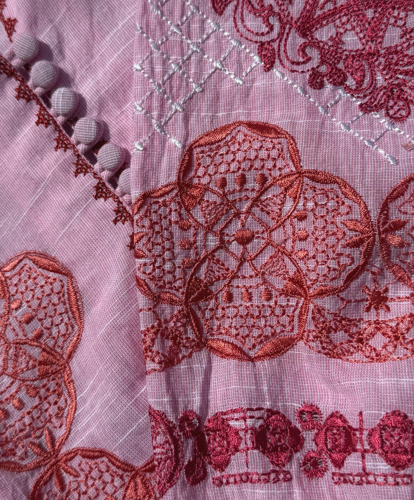 Close up of the pink Alder dress embroidery.