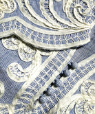 Close up of the tape work decoration on the Amaranta dress.