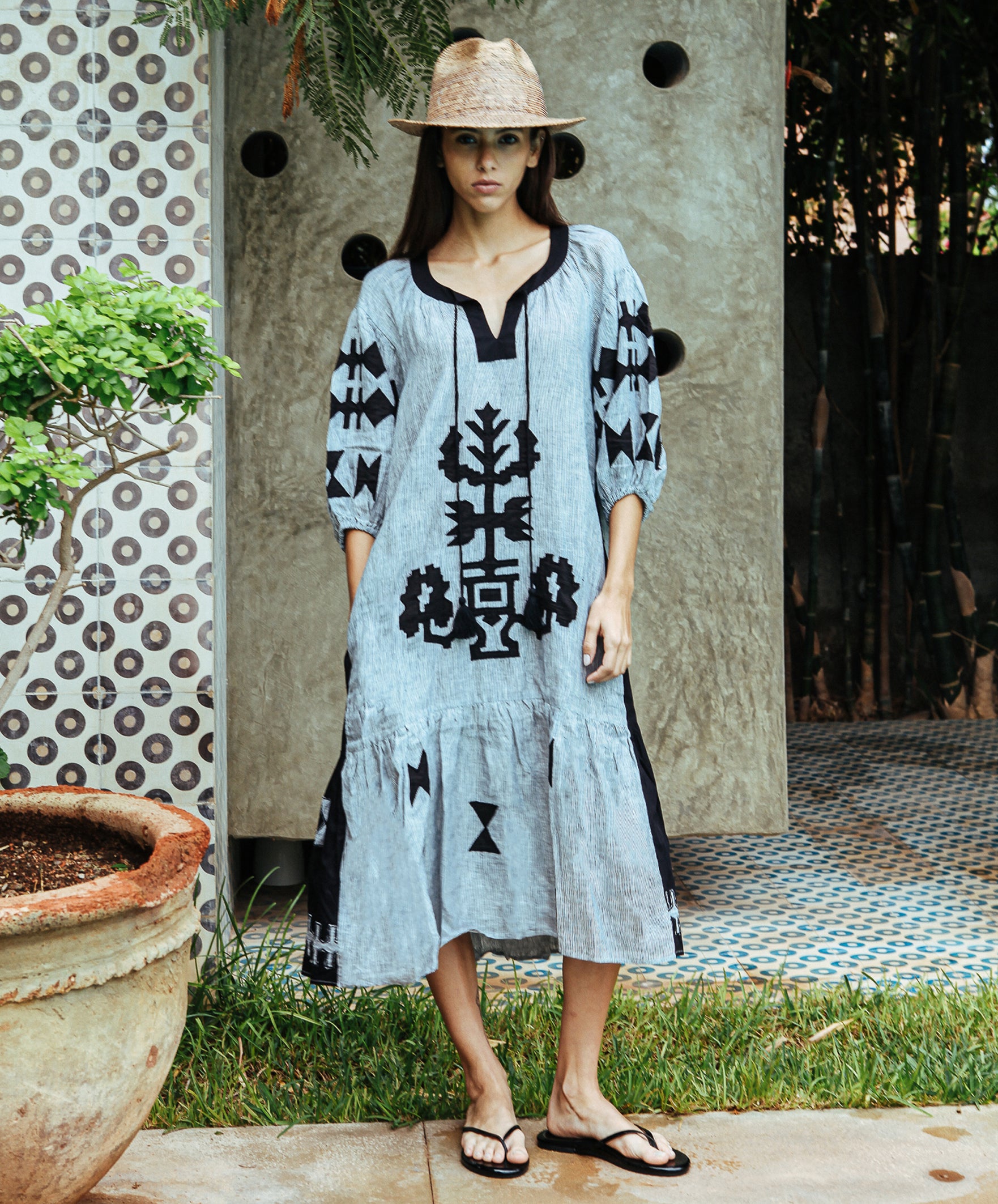 A model wearing a Rose and Rose Amersham striped linen dress. 