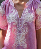 Close up details of the red striped Azalea blouse with white tape embroidery