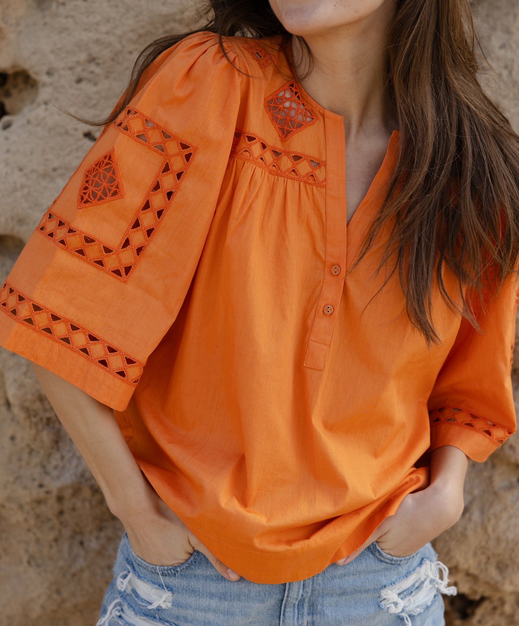 Close up embroidery and cut out details of the Rose and Rose Bordeaux cotton top. 