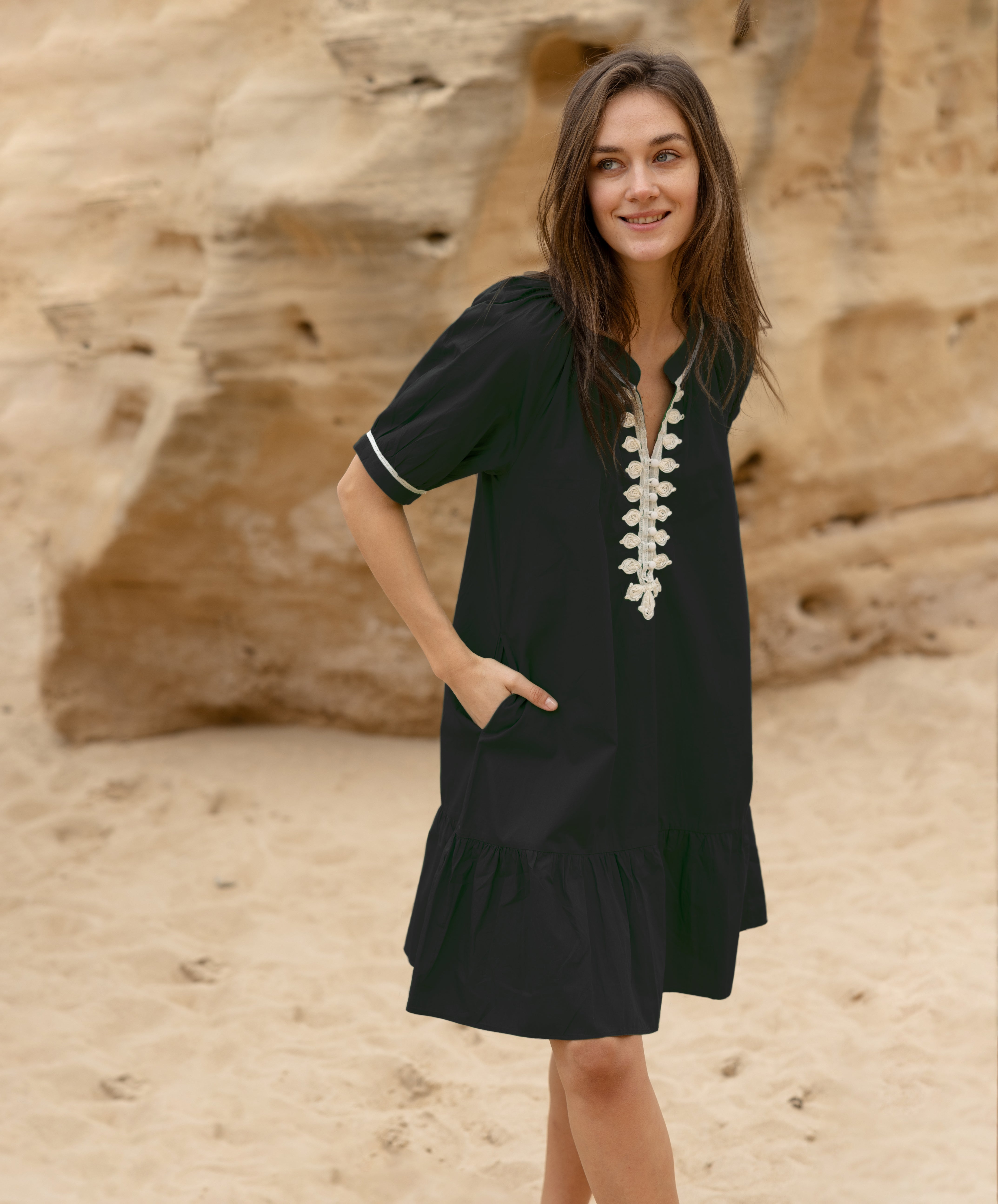 A model wears a Rose and Rose Cannes dress in black