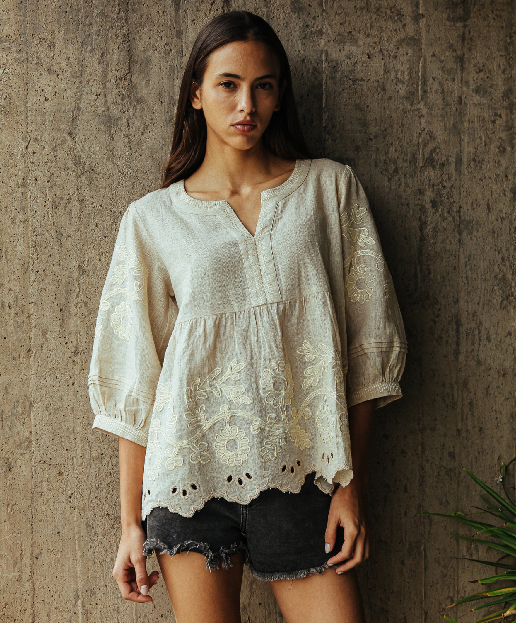 A model wearing a Rose and Rose Goldhawk decorated top in natural linen. 