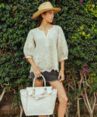 A model wearing a Rose and Rose Goldhawk decorated top in natural linen. 