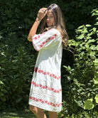 A model wearing a Rose and Rose Holborn dress. 