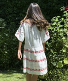 A back view of a model wearing a Rose and Rose Holborn dress. 