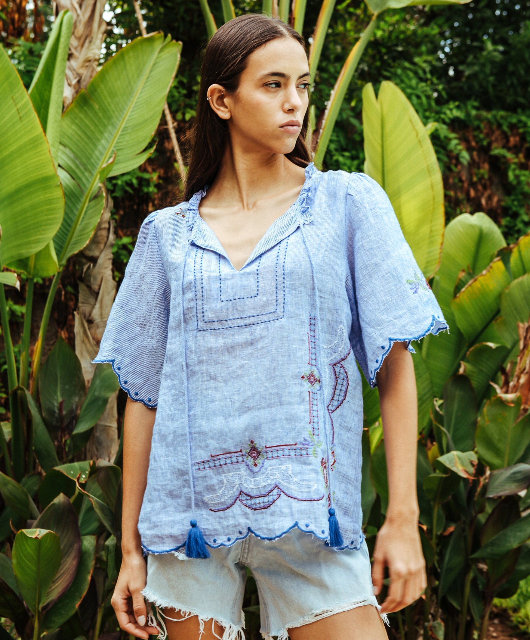 A model wearing a Rose and Rose embroidered Kew top. 