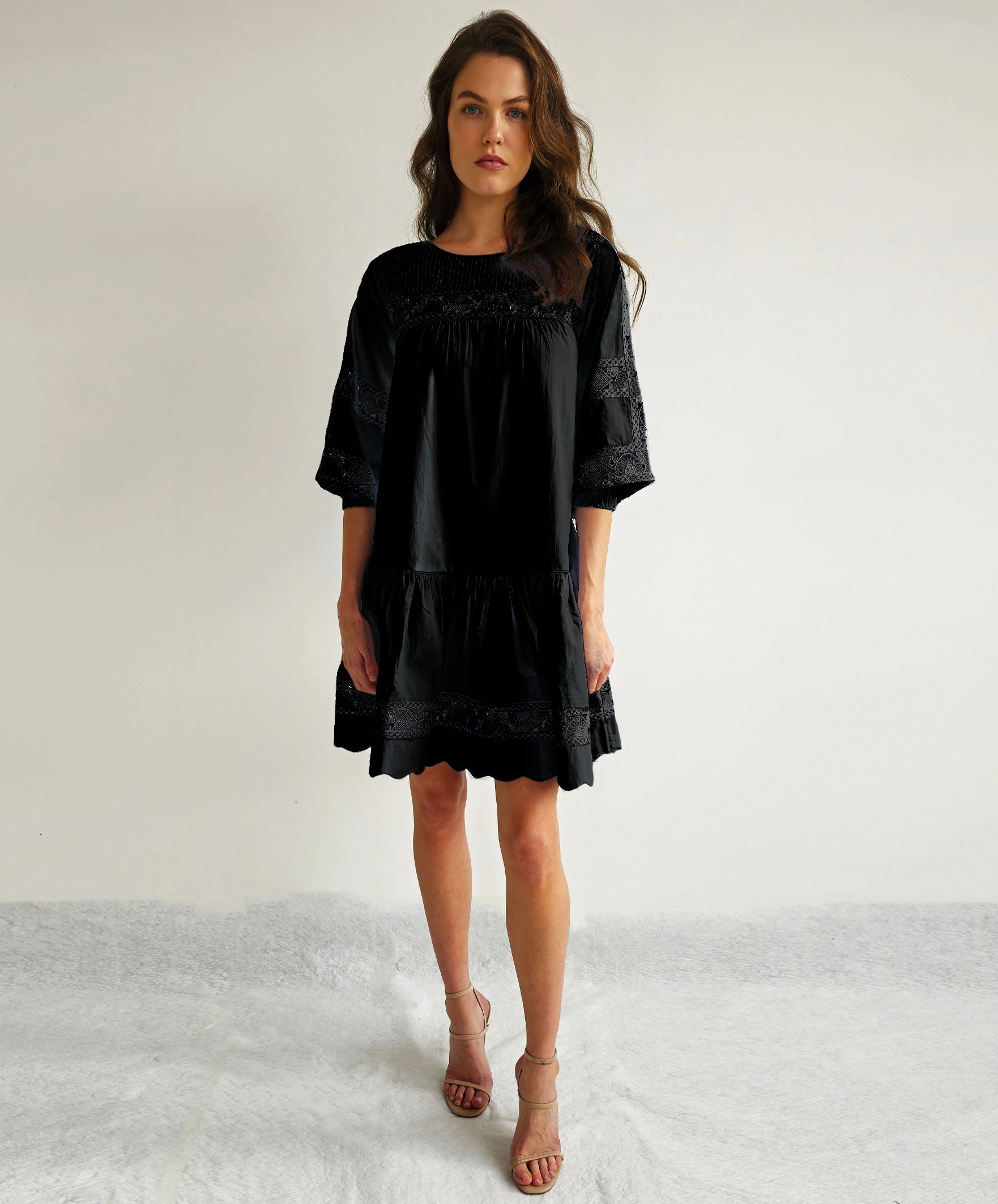 A model wears a Rose and Rose La Rochelle dress in black.