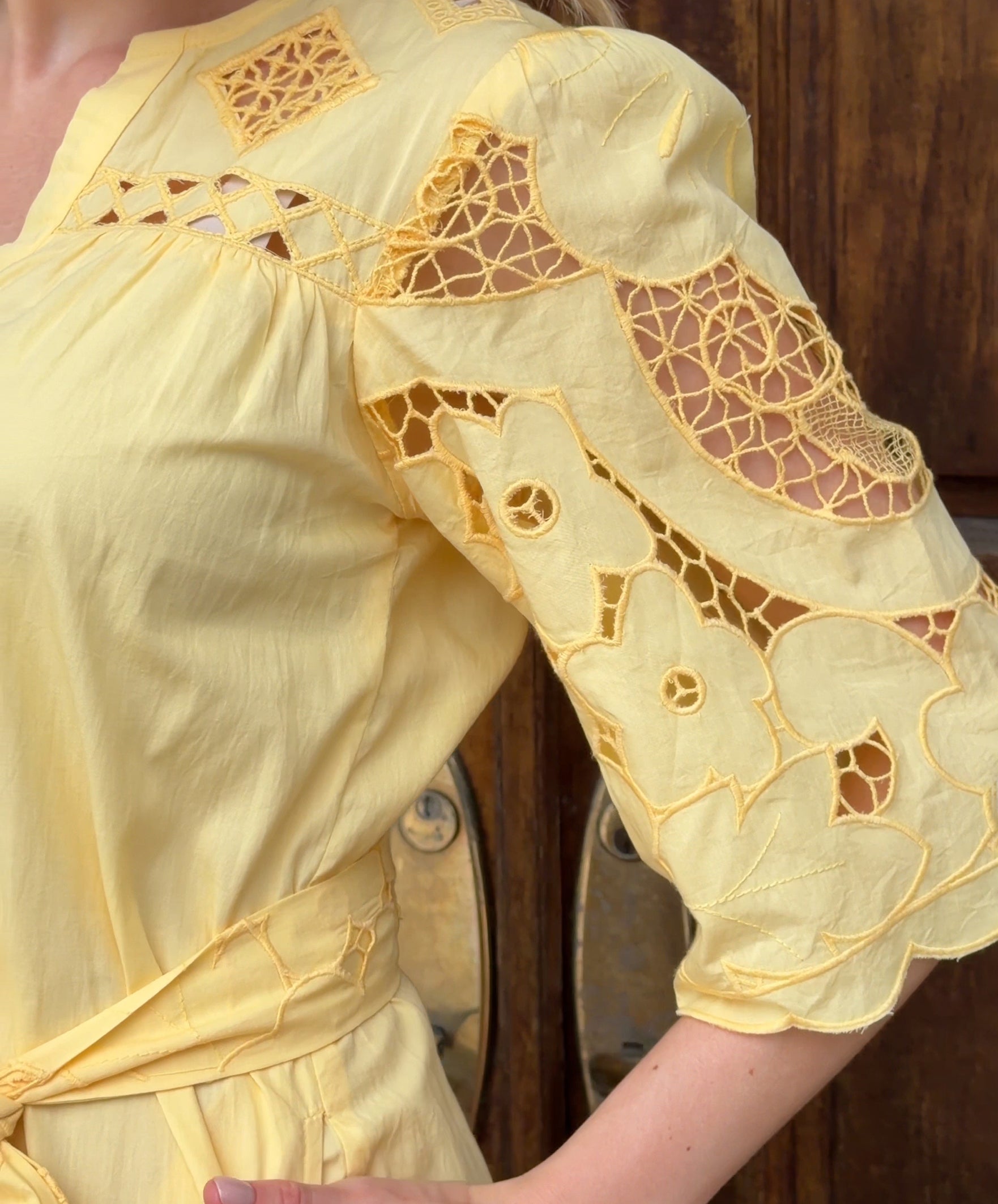 Influencer @viktoria_myr showing the embroidery details on the Dahlia dress. 